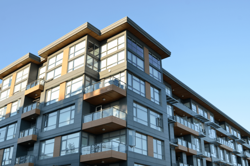 Grey apartment building. asbestos in residential properties