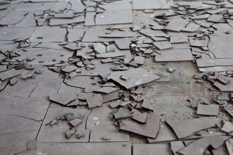 Broken asbestos floor tiles; asbestos tiles.