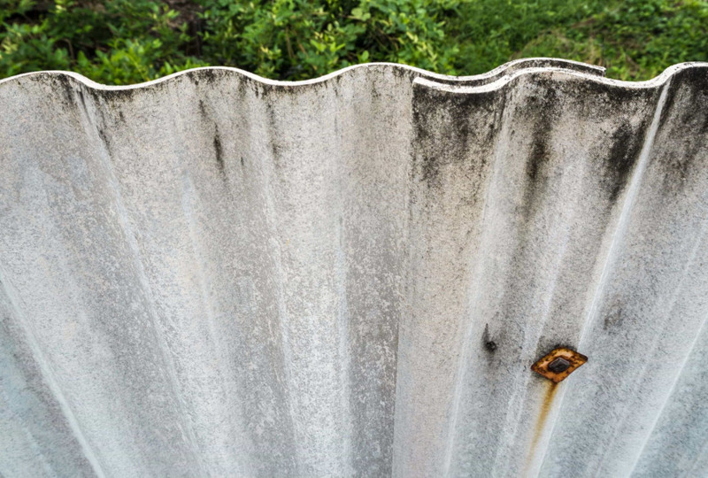 Commercial fence sheeting that contains asbestos
