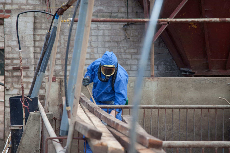 Rapid team member conducting asbestos monitoring.