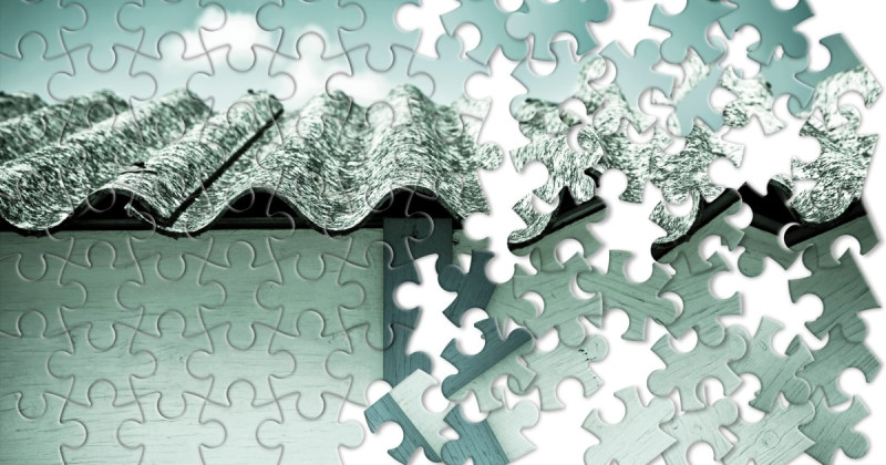 Concept showing removal of asbestos-containing materials, the image is in a puzzle shape. asbestos cement sheeting