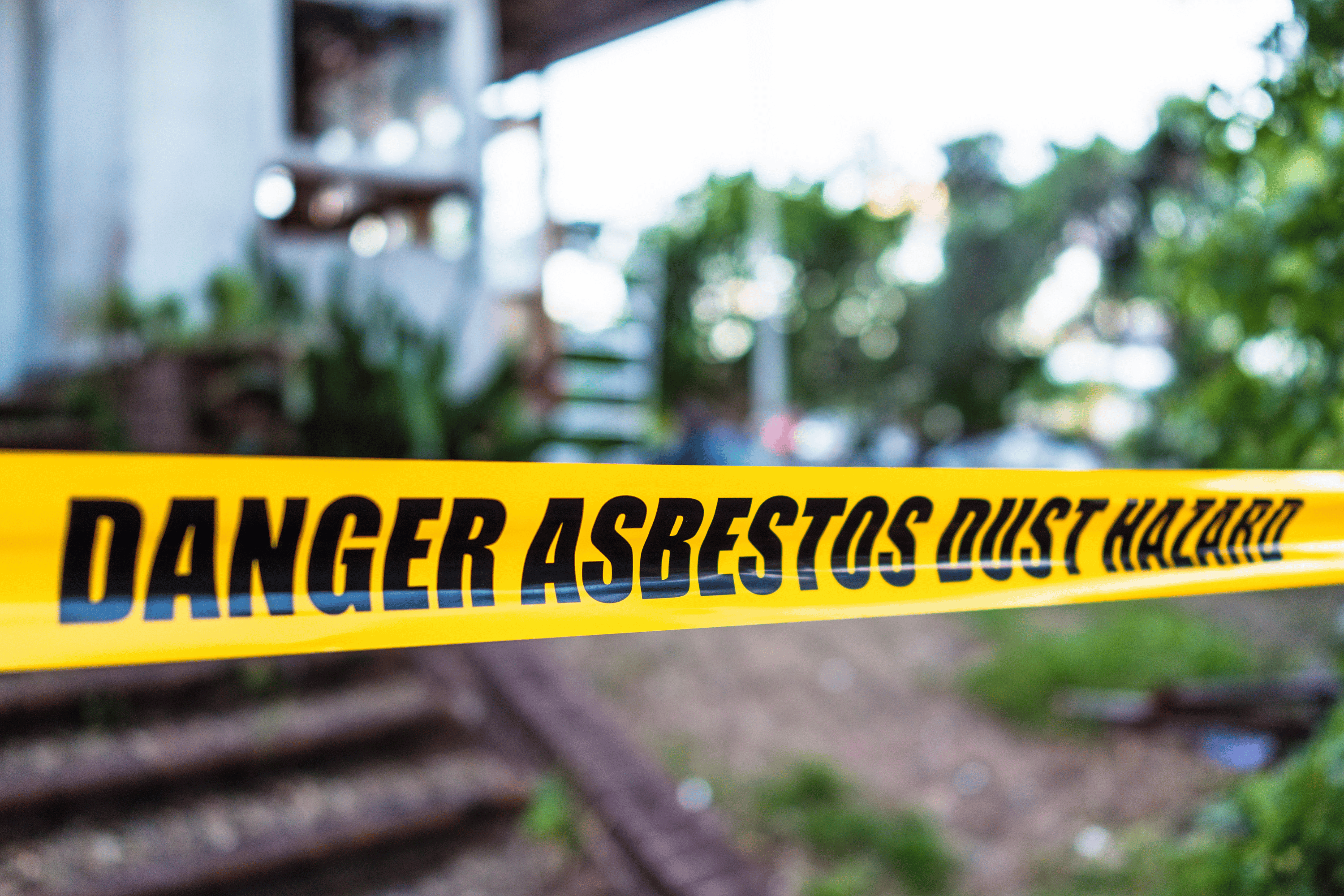 Asbestos Tile: Is It Safe to Remove on Your Own? 1 'Danger asbestos dust hazard' yellow tape. friable asbestos