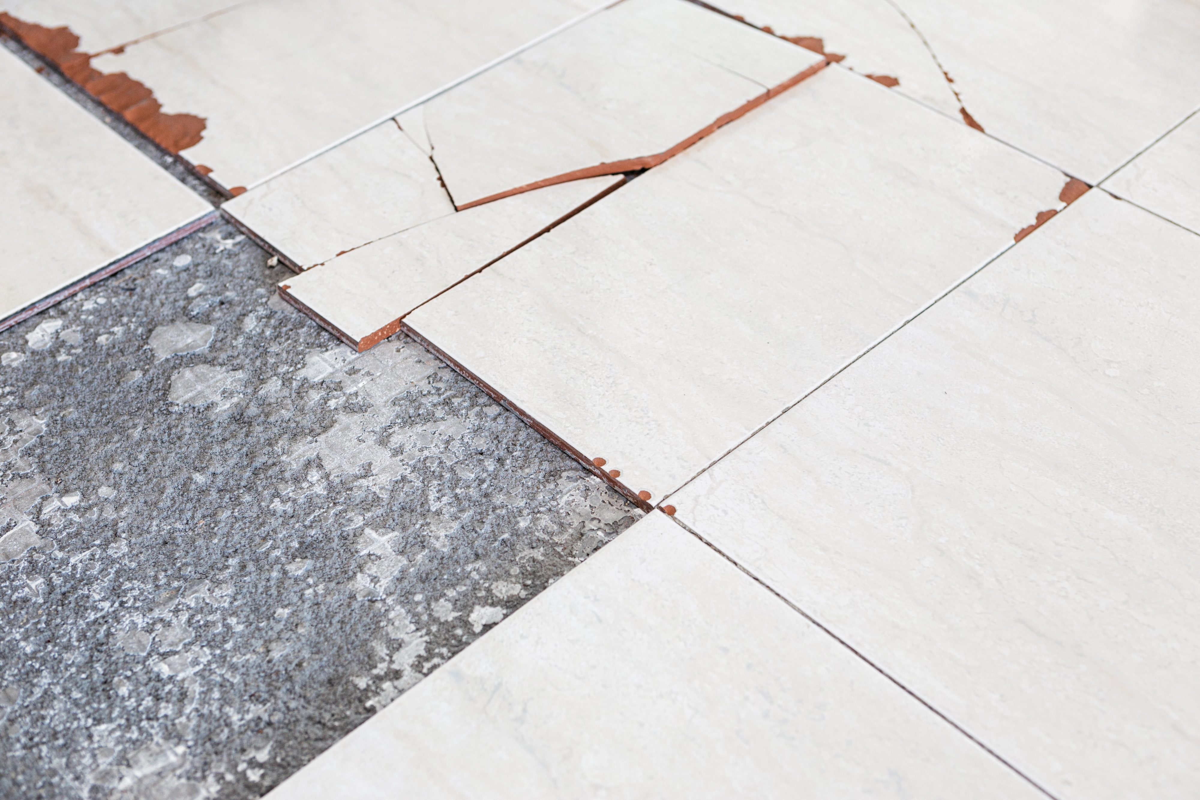 Where Is Asbestos Found in Old Homes? 2 Chipped asbestos floor tiles. asbestos flooring