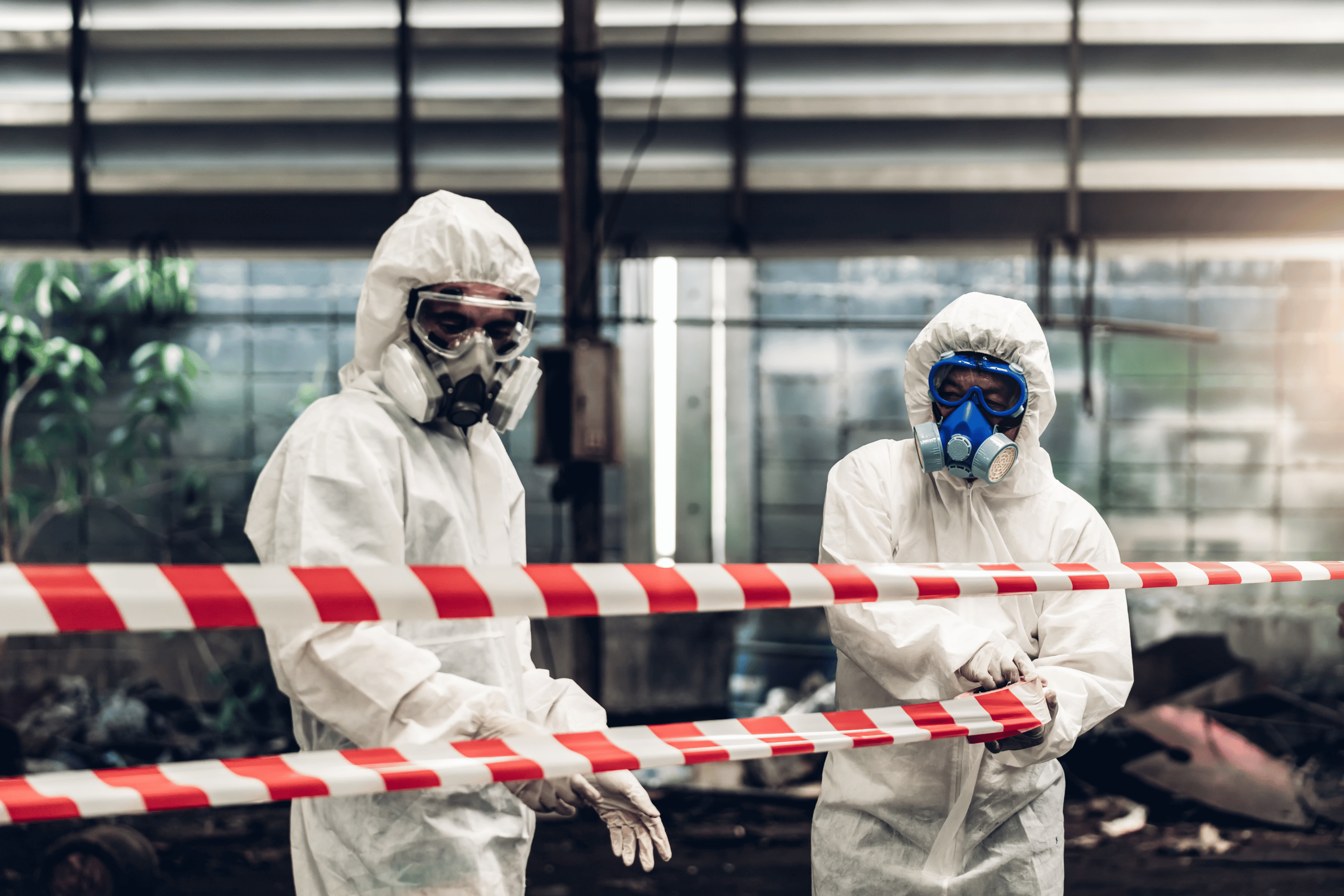 Asbestos Tile: Is It Safe to Remove on Your Own? 2 Asbestos removalists in PPE gear, ready to remove asbestos. asbestos removal services