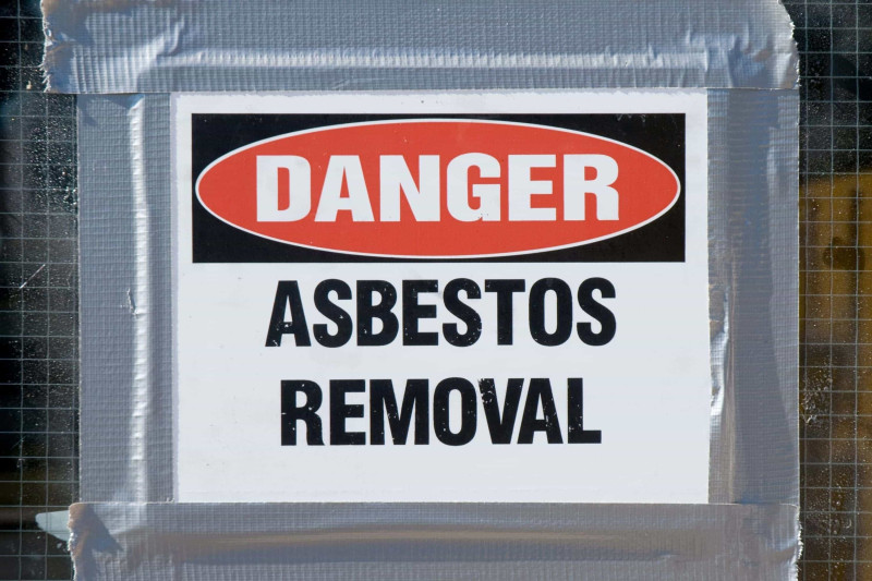 Licensed asbestos removal in progress sign.
